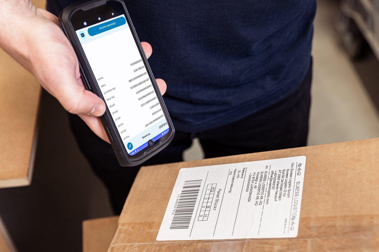 Shipping label on a carton being scanned at SUXESS LOGISTIC